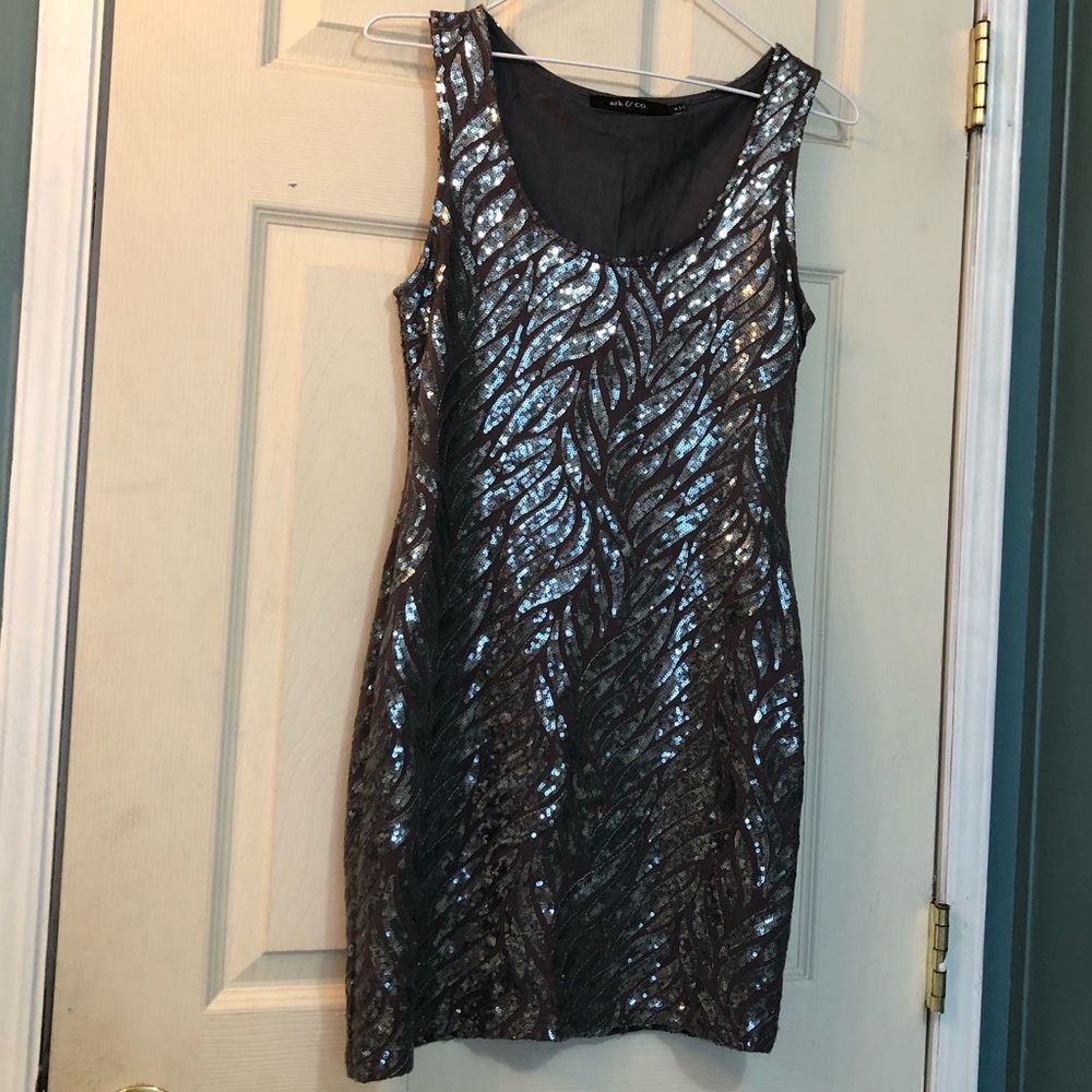 A dark purple dress with blue sequins